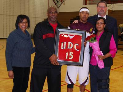 UDC A.D. Patricia Thomas and Coach Ruland are pictured with Tim Ellison and his parents Mr. & Mrs. Leon Ellison during Senior Night presentation