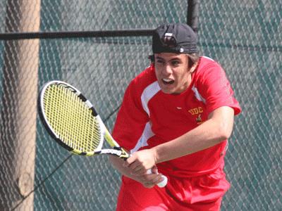 Miguel Uzcatequi uses his power to return a ball enroute to his singles match win
