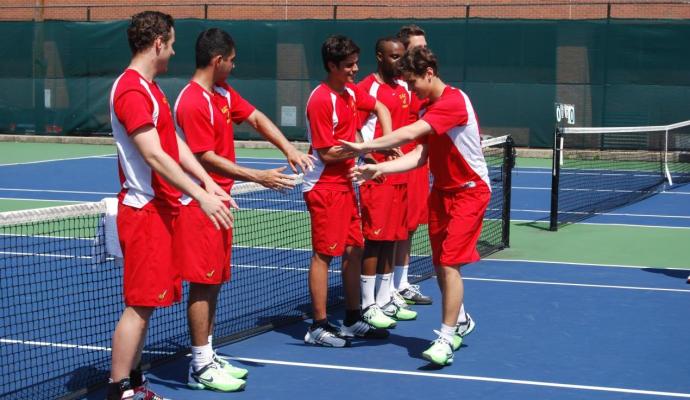 Simon Andersson (shown high-fiving his teammates) came up with a singles and doubles victory in the 5-0 shutout win over STAC.