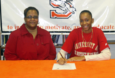 Julissa Anderson pictured with her mother Taron Manuel signing her National Letter of Intent to play for UDC